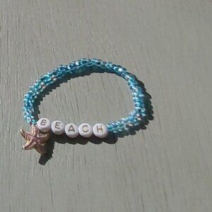 Handmade bracelet with pink starfish